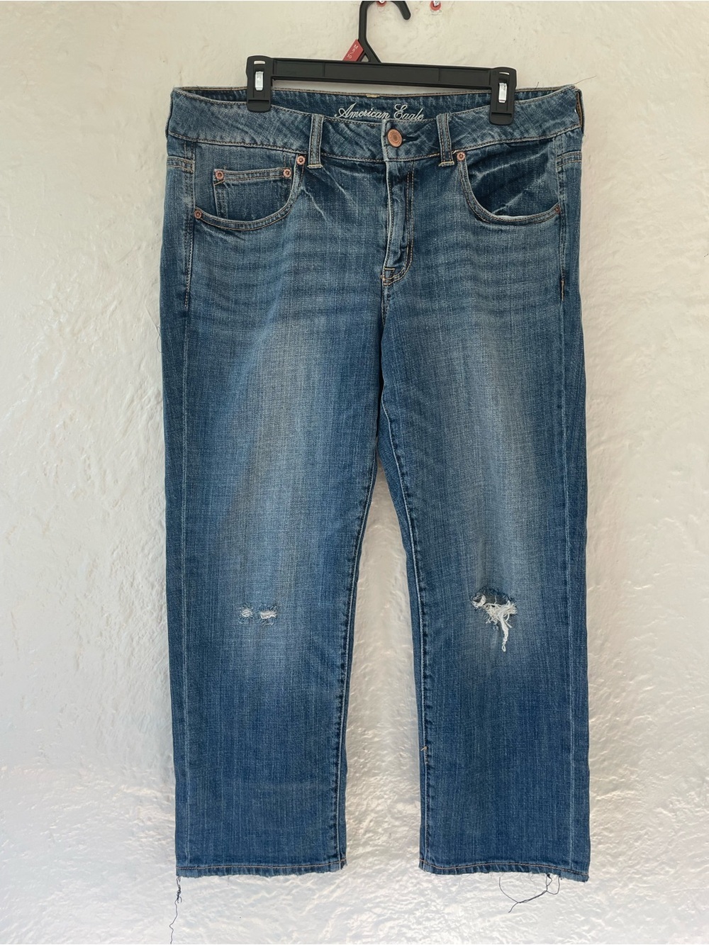 American Eagle Boy Fit loose, high waisted, distressed, mid-wash jeans; 12